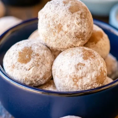 Delicious Gingerbread Snowball Cookies on a festive baking tray