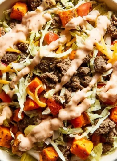 Sweet potato burger bowl with ground beef and fresh vegetables