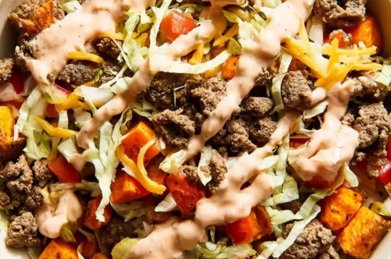 Sweet potato burger bowl with ground beef and fresh vegetables
