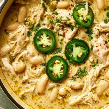 Bowl of White Chicken Chili topped with fresh cilantro and jalapenos.