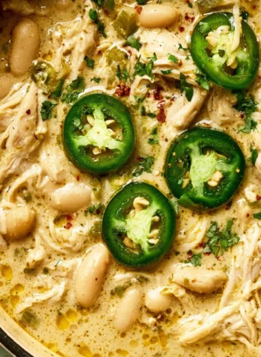 Bowl of White Chicken Chili topped with fresh cilantro and jalapenos.